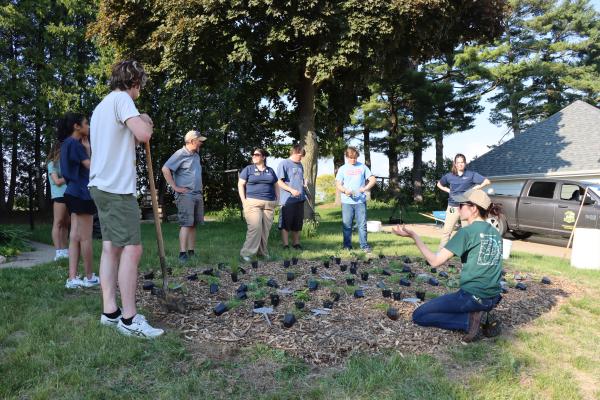 teens planting pollinator garden