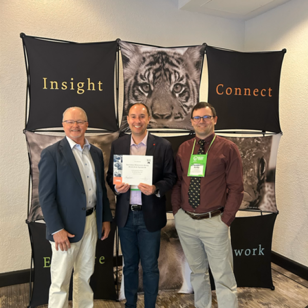 Kurt Strand, Tommy Lange, and Andy Allison accepting the accreditation